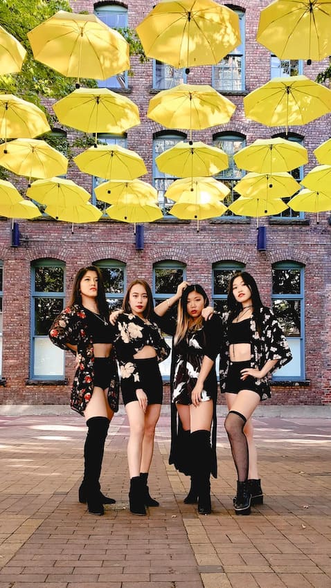 dance teaser photo of four friends in downtown Vancouver