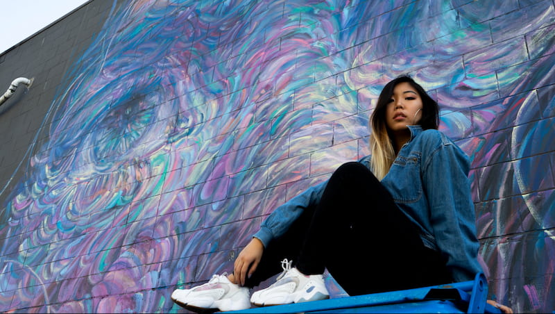 content marketer modelling in front of a mural in Vancouver